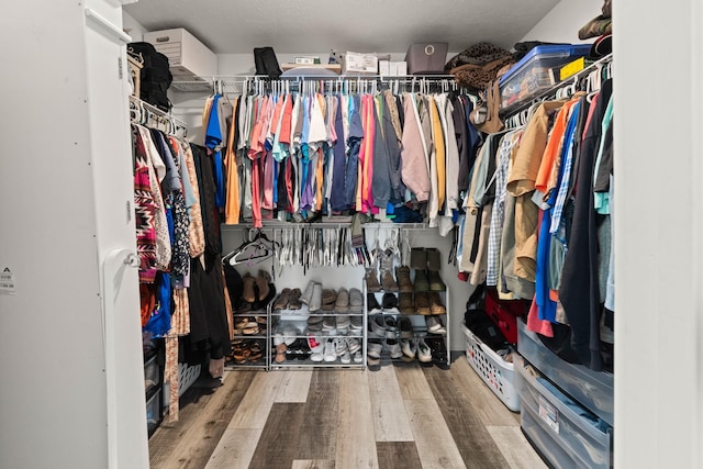 spacious closet with wood finished floors