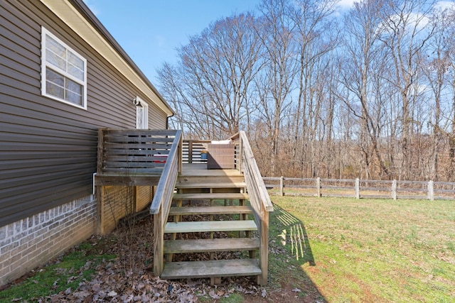 view of yard with stairs, fence, and a wooden deck