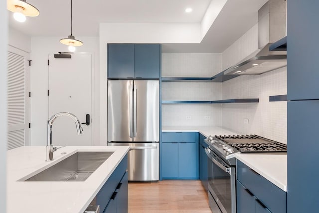 kitchen featuring light countertops, appliances with stainless steel finishes, open shelves, and blue cabinetry