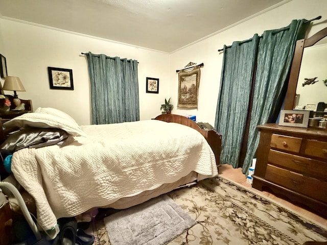 bedroom with crown molding