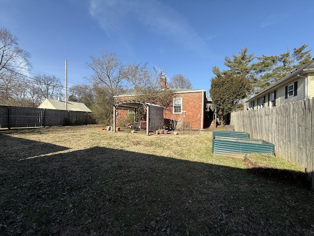 view of yard with a fenced backyard and a pergola