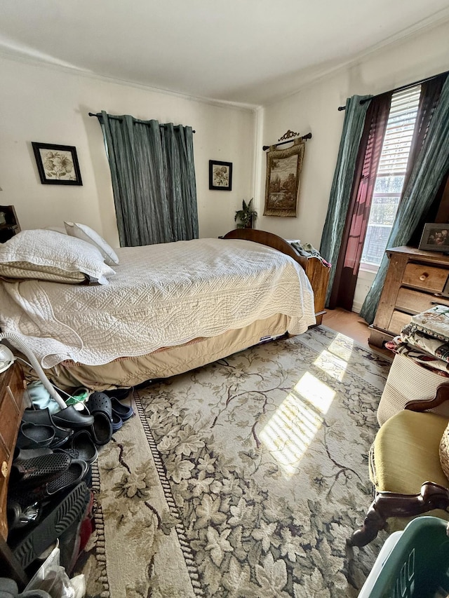 bedroom with crown molding