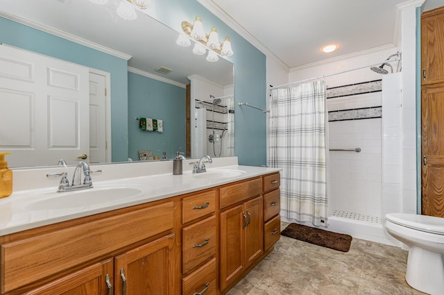 full bathroom featuring double vanity, a shower stall, ornamental molding, and a sink