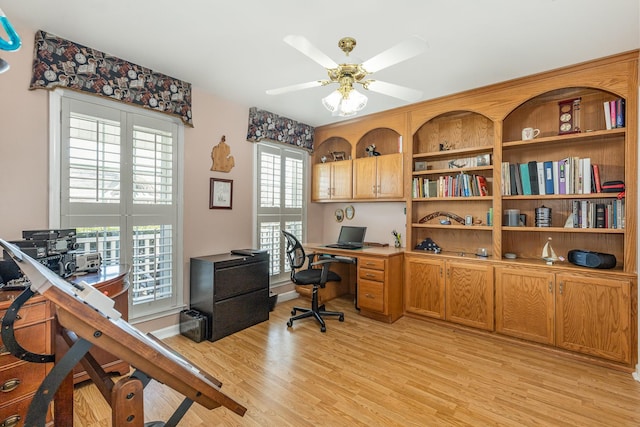 office area featuring light wood-style floors and a ceiling fan