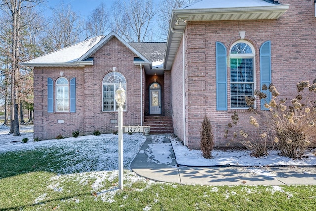 view of front of home featuring brick siding