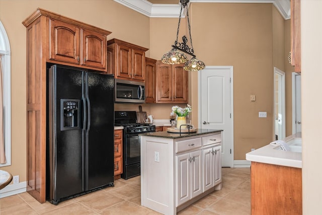 kitchen featuring black appliances, brown cabinetry, dark countertops, and a kitchen island