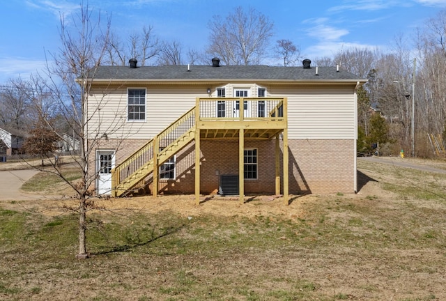 rear view of house featuring stairs, brick siding, cooling unit, and a deck