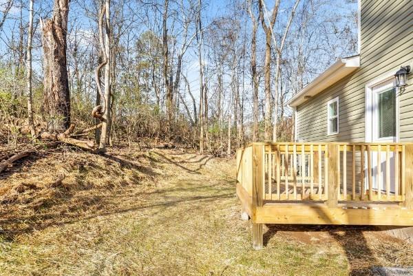 view of yard with a wooden deck