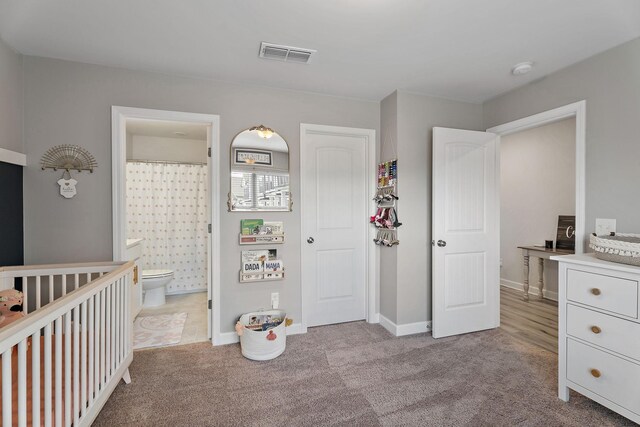 805 Coronation Dr, Antioch, TN 37013 - bedroom with light colored carpet, visible vents, baseboards, and ensuite bathroom