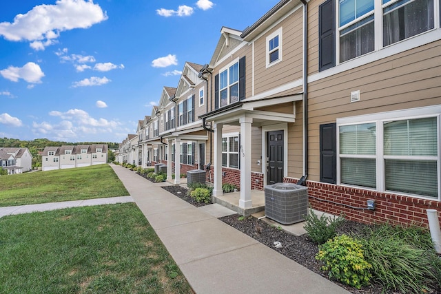 view of home's community with a residential view and a lawn