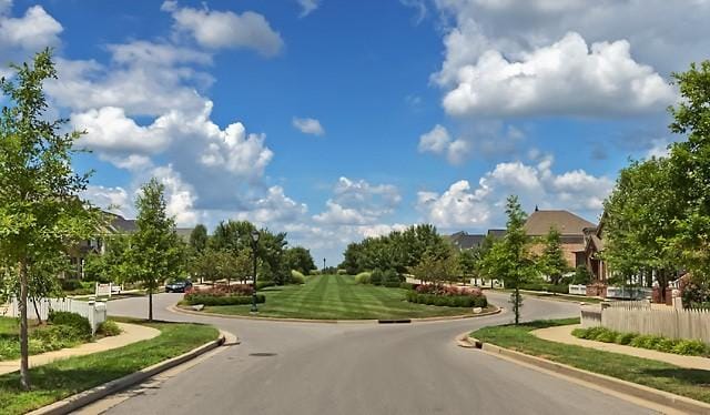 view of road featuring sidewalks and curbs