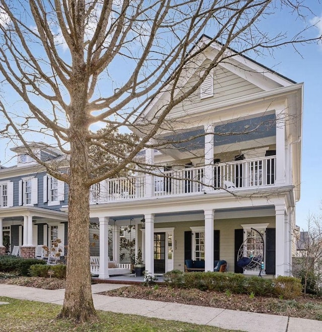 neoclassical / greek revival house featuring a porch