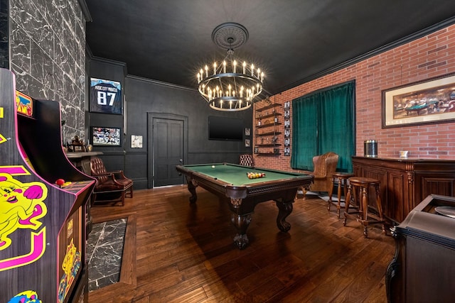 game room featuring brick wall, wood finished floors, and crown molding