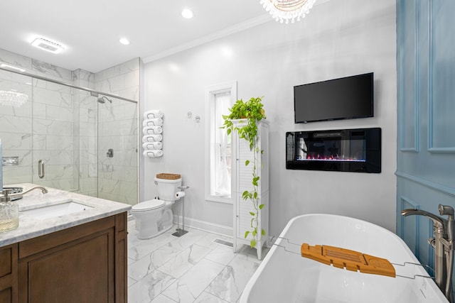 full bath with toilet, vanity, baseboards, a freestanding bath, and marble finish floor