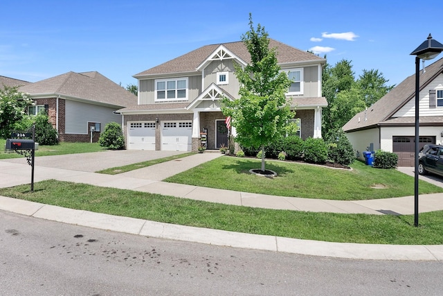 view of front of property featuring a garage, driveway, roof with shingles, a front lawn, and board and batten siding