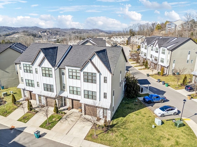 birds eye view of property with a residential view