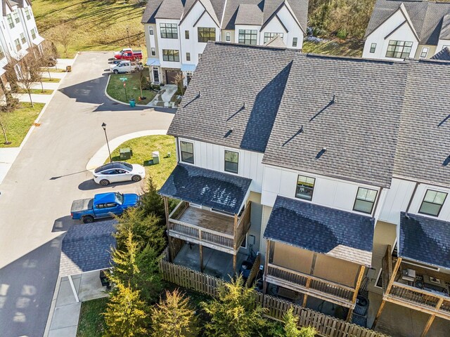 birds eye view of property with a residential view