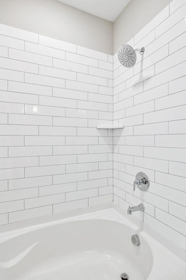 bathroom with washtub / shower combination