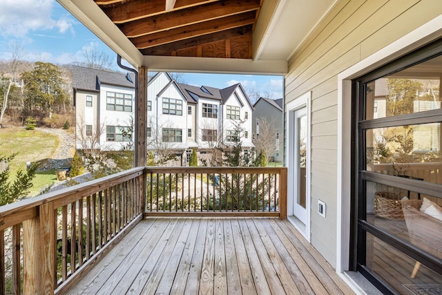 wooden terrace with a residential view