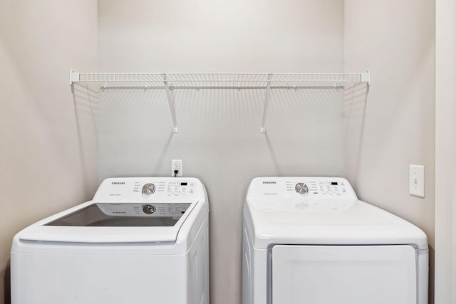 laundry room featuring laundry area and separate washer and dryer