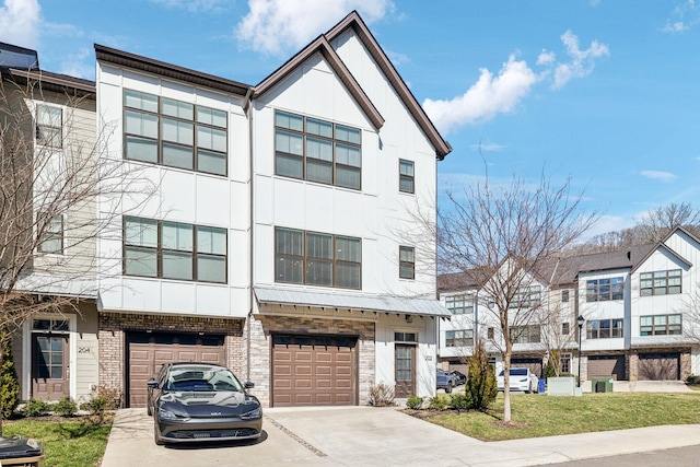 view of front of home with a garage, driveway, and brick siding