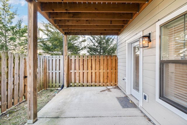 view of patio / terrace featuring fence