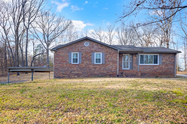 single story home featuring brick siding and a front lawn