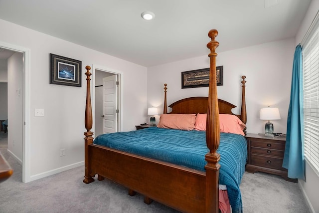 bedroom featuring carpet flooring and baseboards