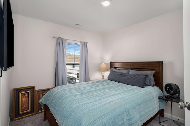 bedroom with baseboards, visible vents, and carpet flooring