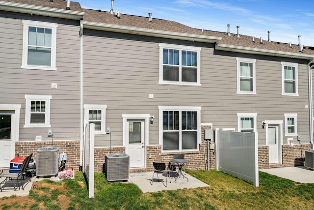 back of house featuring a patio area, a yard, fence, and central AC unit