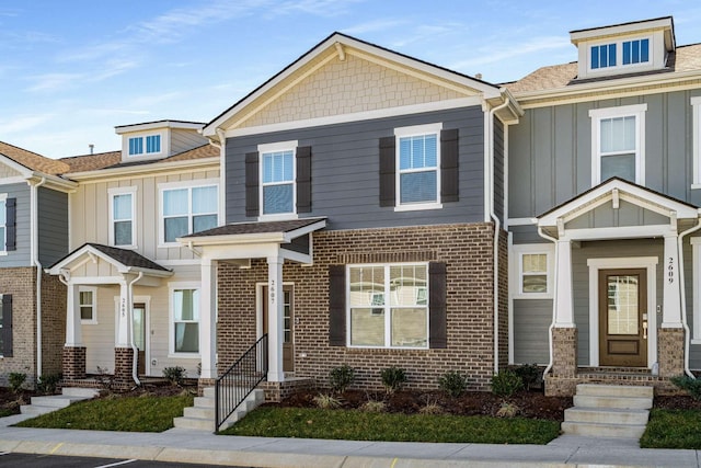 multi unit property featuring board and batten siding and brick siding