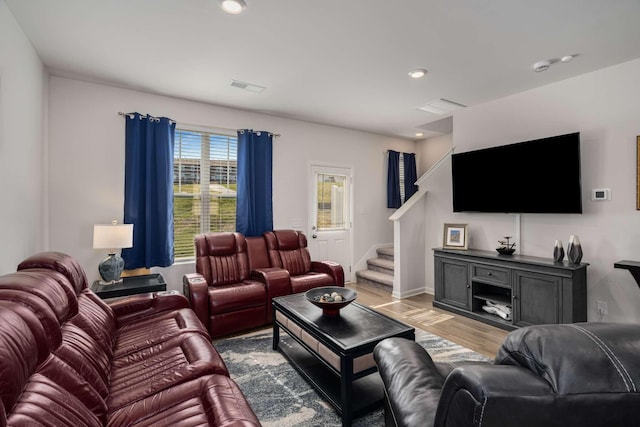 living room with recessed lighting, visible vents, stairway, light wood-style floors, and baseboards