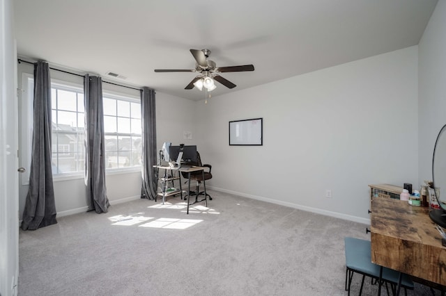 home office featuring light carpet, visible vents, and baseboards