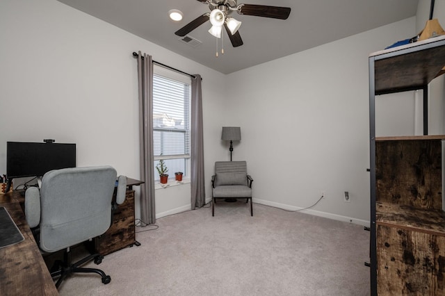 office space with light carpet, ceiling fan, visible vents, and baseboards