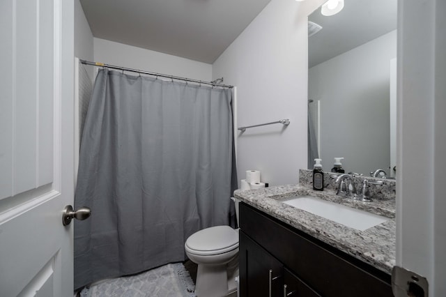 bathroom with a shower with curtain, vanity, and toilet