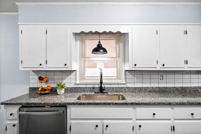 kitchen with dishwasher, backsplash, a sink, and white cabinets