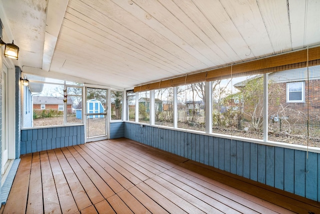 unfurnished sunroom with vaulted ceiling