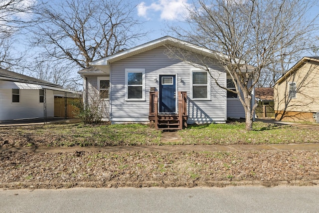 bungalow-style home featuring entry steps