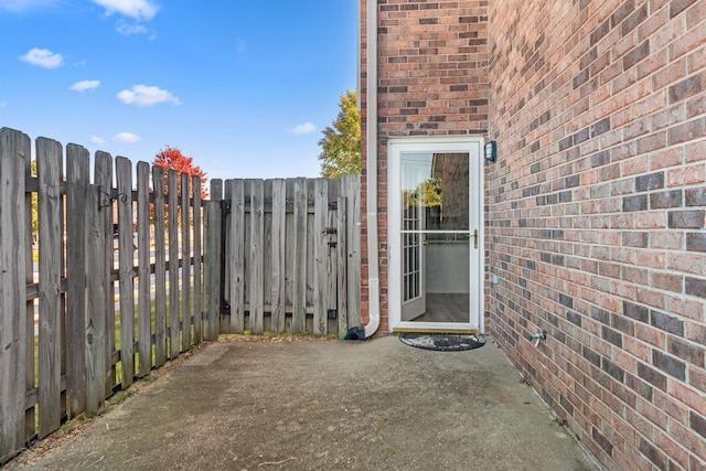 view of patio / terrace featuring a gate and fence