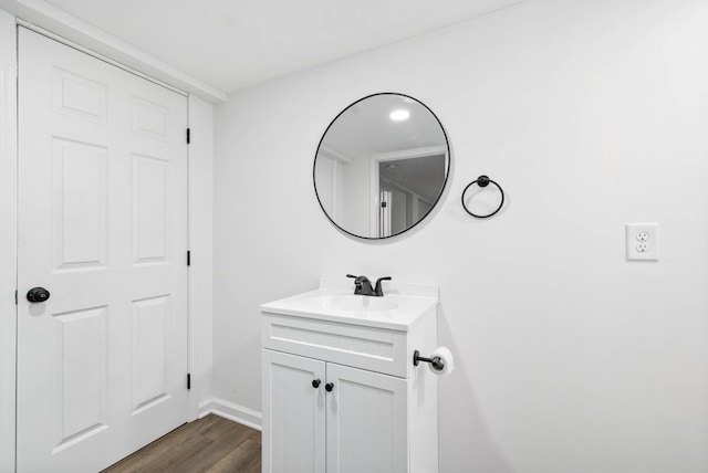 bathroom featuring vanity and wood finished floors