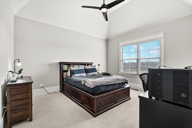 bedroom featuring lofted ceiling, ceiling fan, baseboards, and light colored carpet