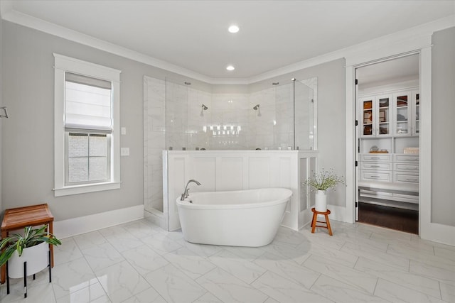 full bathroom featuring a freestanding tub, marble finish floor, crown molding, and a tile shower