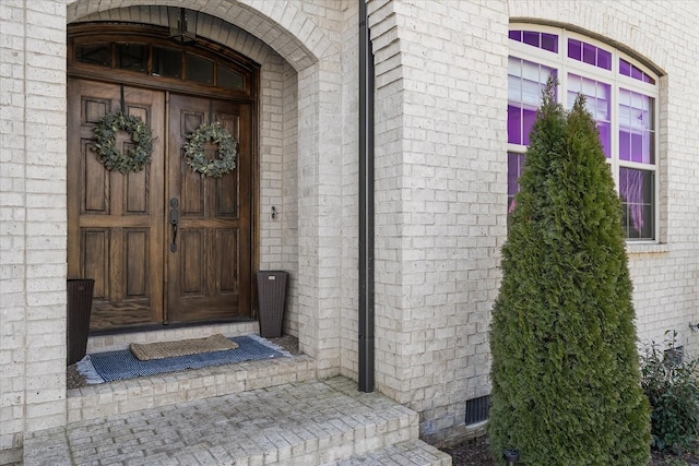 entrance to property with brick siding