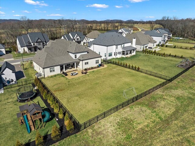 birds eye view of property with a residential view