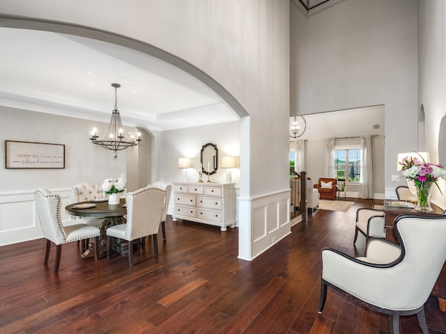 5562 Hardeman Springs Blvd, Arrington, TN 37014 - dining room with a chandelier, arched walkways, hardwood / wood-style flooring, a raised ceiling, and crown molding