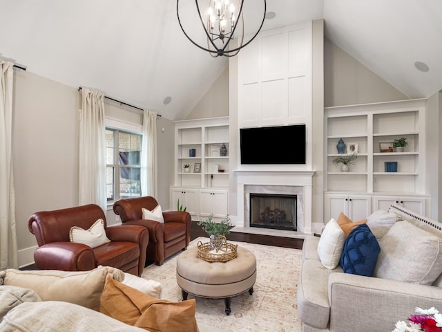 5562 Hardeman Springs Blvd, Arrington, TN 37014 - living area featuring a chandelier, wood finished floors, a fireplace, and high vaulted ceiling