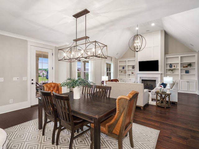 5562 Hardeman Springs Blvd, Arrington, TN 37014 - dining space with a chandelier, dark wood-style floors, built in shelves, lofted ceiling, and baseboards