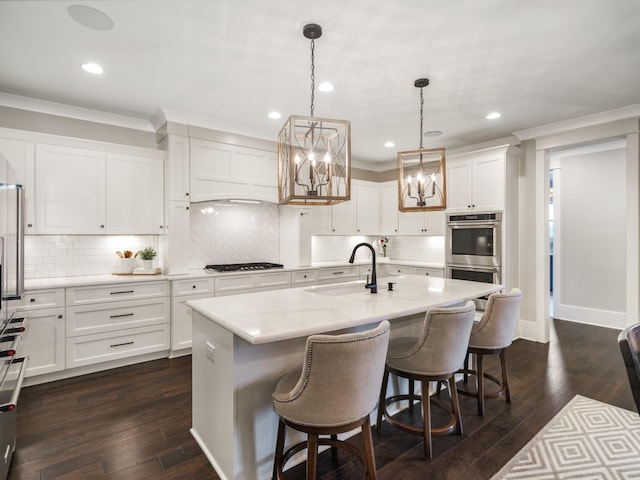 5562 Hardeman Springs Blvd, Arrington, TN 37014 - kitchen featuring a sink, stainless steel double oven, ornamental molding, white cabinets, and recessed lighting