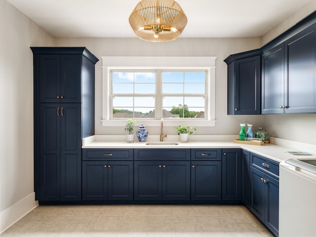 5562 Hardeman Springs Blvd, Arrington, TN 37014 - kitchen featuring a sink, blue cabinetry, light countertops, and light tile patterned flooring