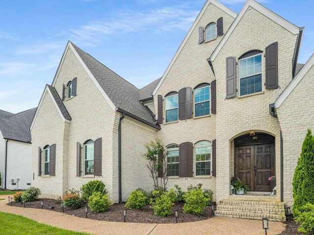 5562 Hardeman Springs Blvd, Arrington, TN 37014 - french country inspired facade with brick siding and roof with shingles